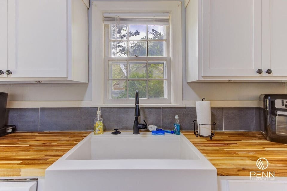 Wash up with a peaceful view of the greenery right from the farmhouse sink.