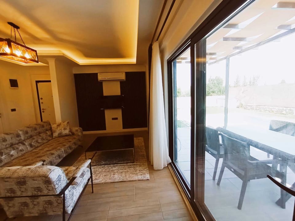 Comfort Villa, Mountain View, Poolside | Living area | 43-inch Smart TV with satellite channels