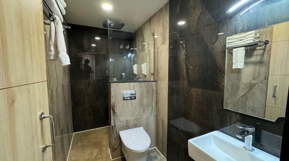 Shower, slippers, towels, soap
