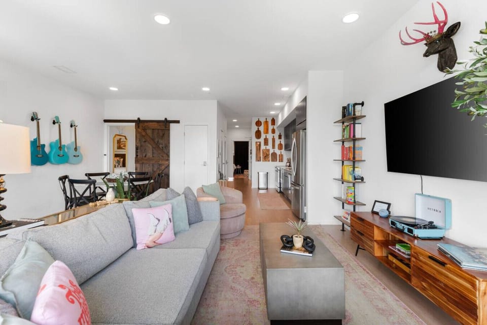 Spacious living room with queen pull-out couch, stunning riverfront views, and a Smart TV for your entertainment. Enjoy your morning coffee on our private patio that overlooks Cumberland river.