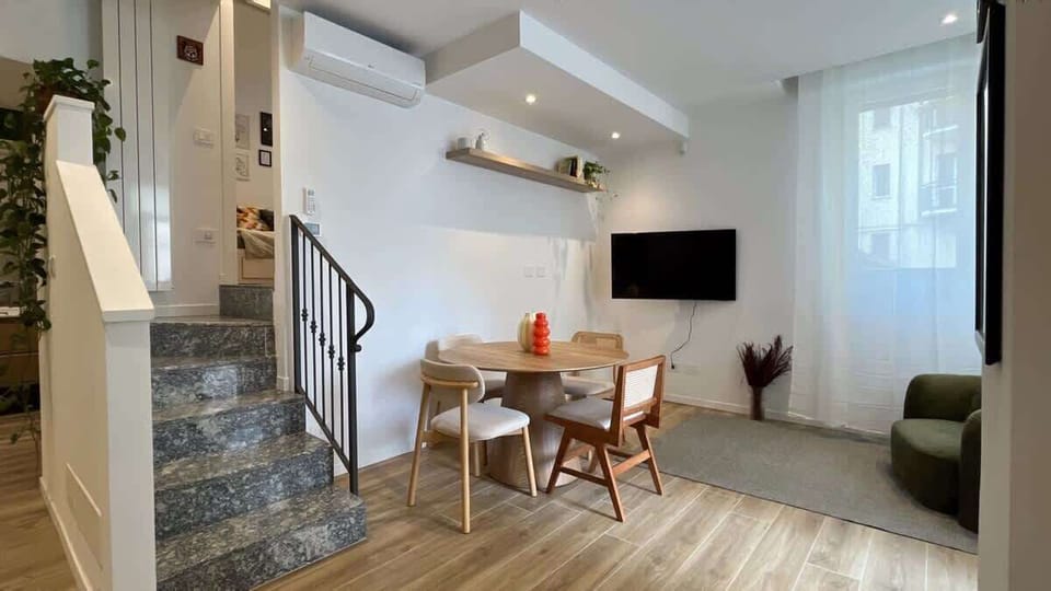 Living room with kitchen and TV