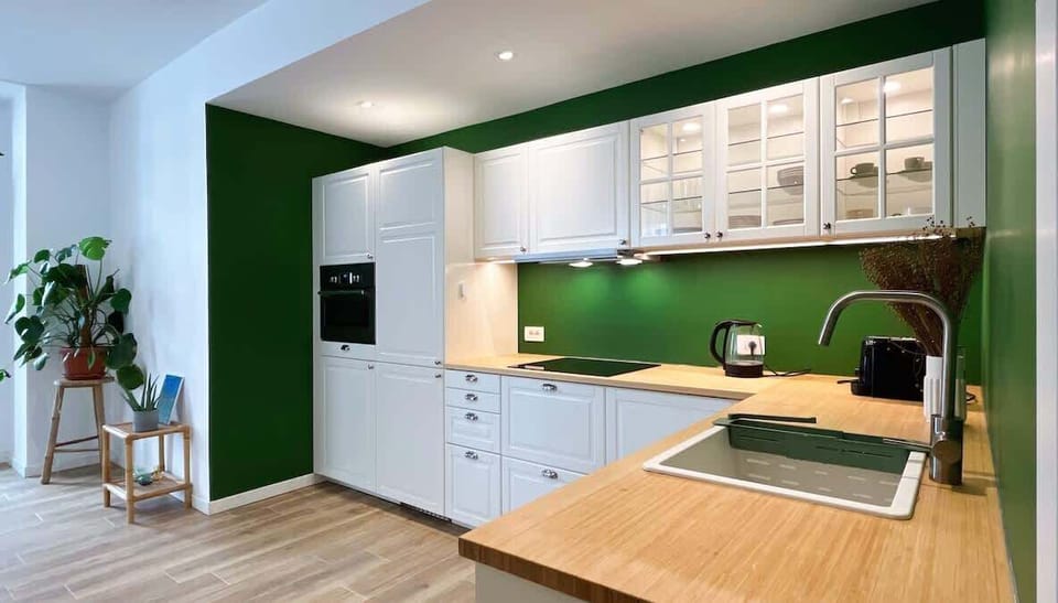 Open space white kitchen with accessories