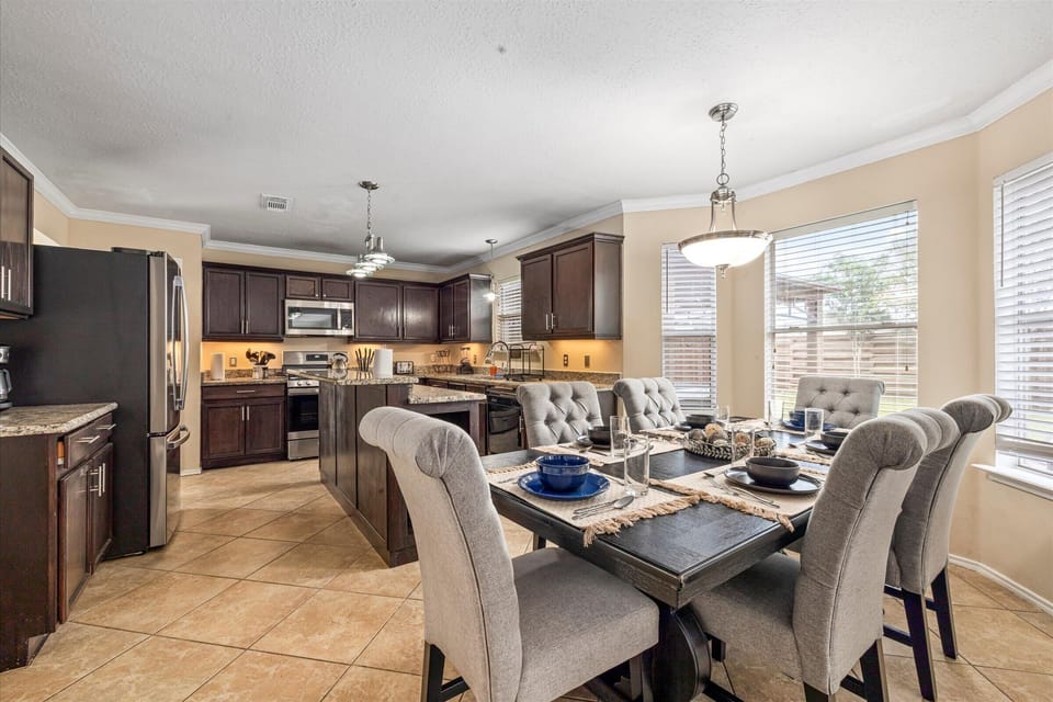 Spacious main dining table that sits 6 with full tableware and silverware included. 