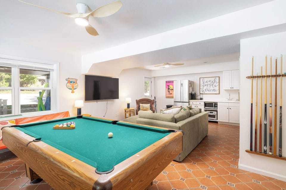 Lower Level: Game room w/ pool table, arcade games, Extra Seating, TV, Kitchenette and deck access