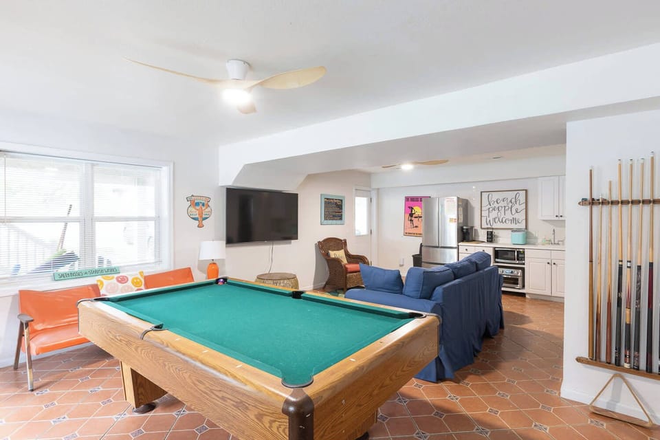 Lower Level: Game room w/ pool table, arcade games, Extra Seating, TV, Kitchenette and deck access