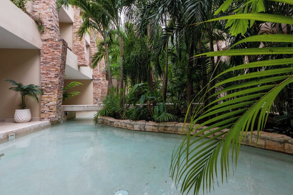 Relax outdoors with fresh air and green views from this inviting space.