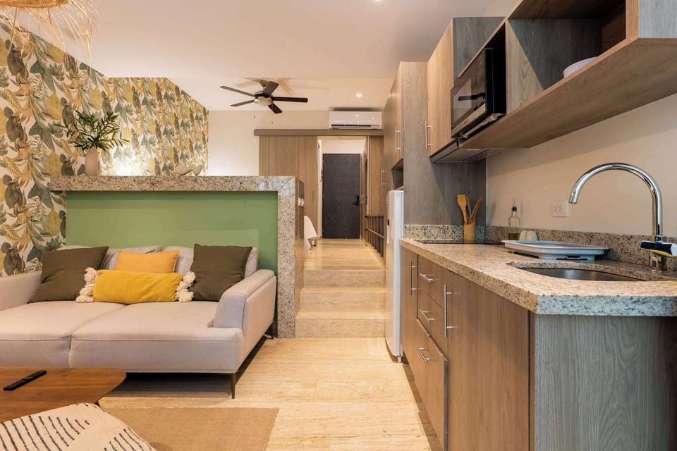 A sleek kitchen with a breakfast bar, ideal for quick bites or socializing.