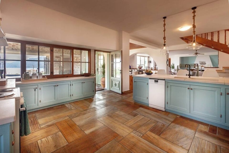 Fully stocked kitchen with back entrance to covered patio.