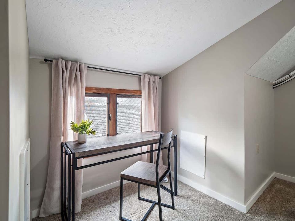 Cozy nook with desk & natural light—perfect for reading or light work ☀️
