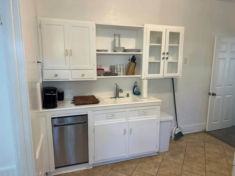 Compact kitchen with essentials and clean white cabinetry