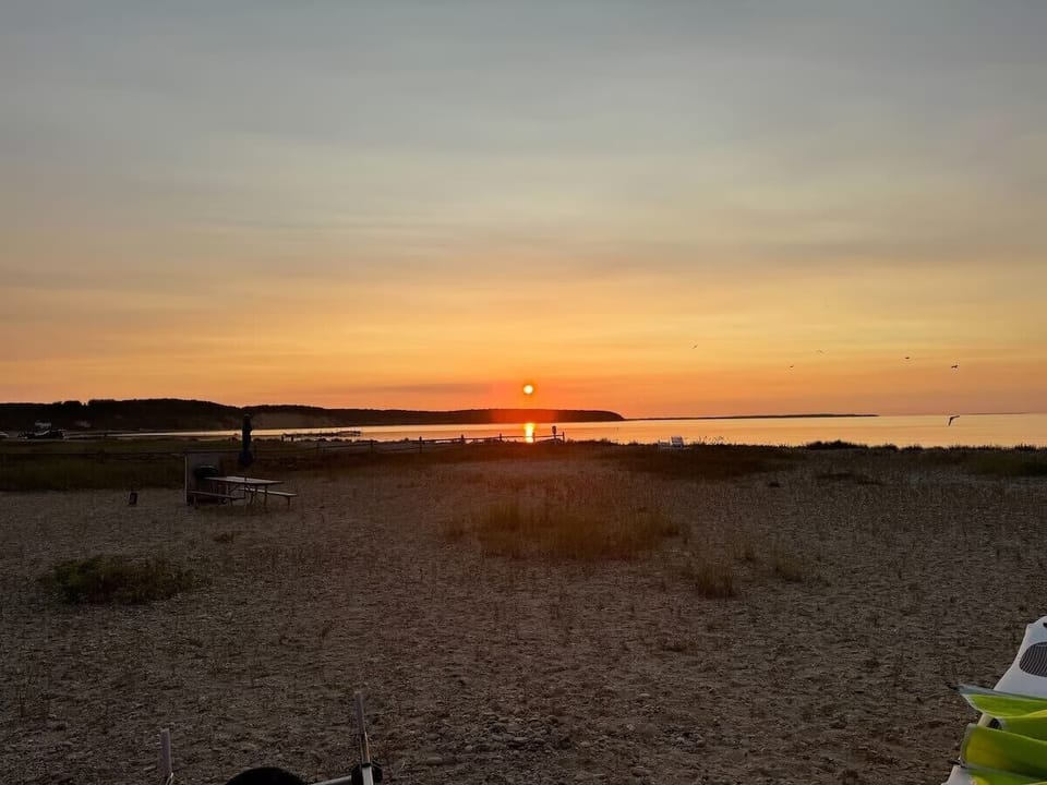 Peaceful beachfront sunset with serene water views