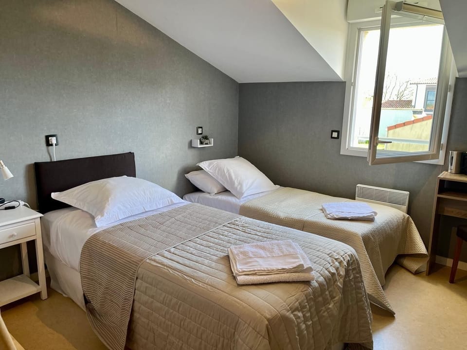 Economy Double Room, Garden View | Desk, laptop workspace, blackout drapes, iron/ironing board