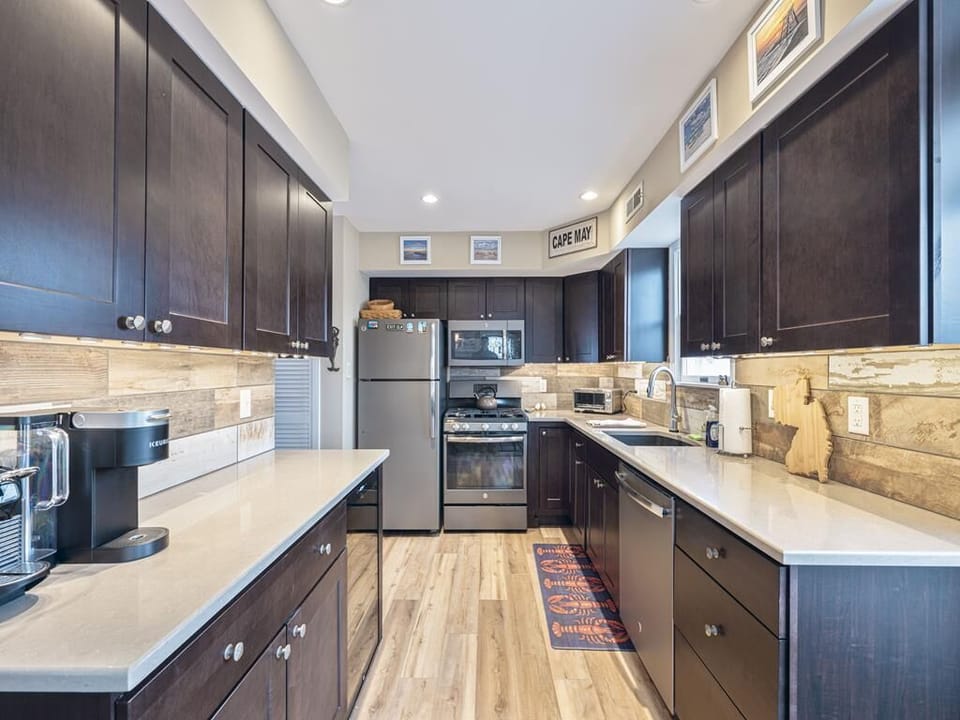 Fully stocked kitchen with sleek countertops and modern finishes for easy meal prep.