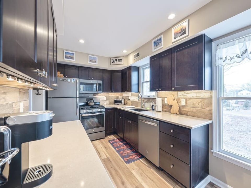 Cook with ease in this stylish kitchen featuring a Keurig, toaster, and more.