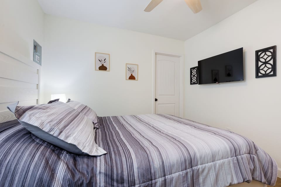 Comfortable queen bed smart TV