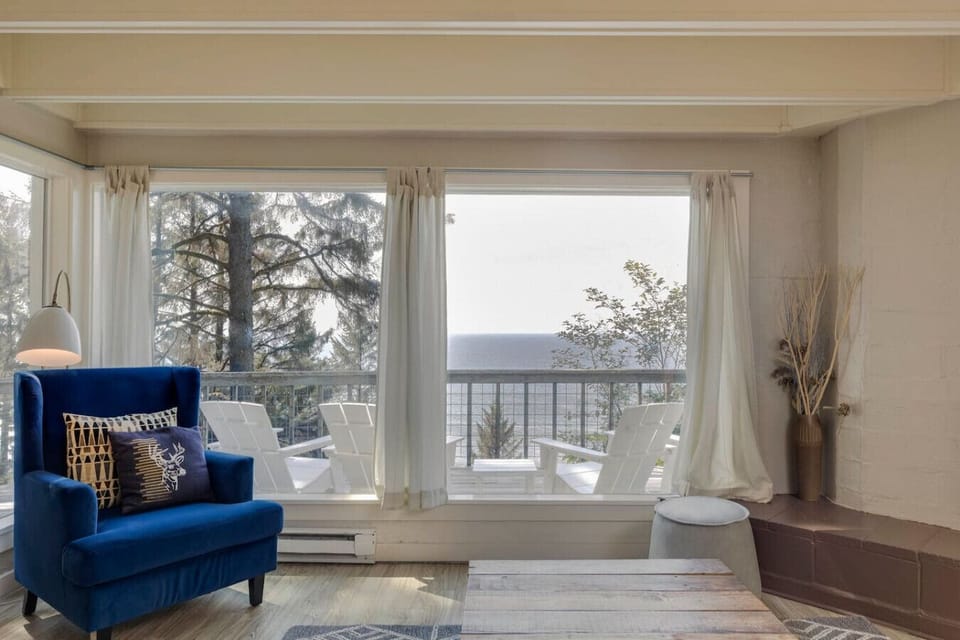 Soak in ocean views right from the comfort of the living room. Cozy seating by the windows makes this the perfect spot for morning coffee, reading, or simply enjoying the scenery.