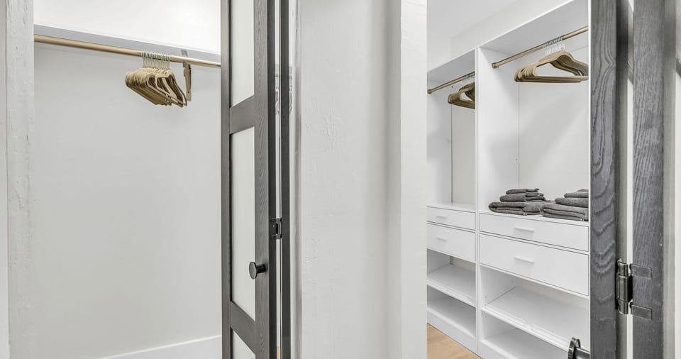 The suite’s double closet features sleek built-ins and abundant storage, combining style with function.