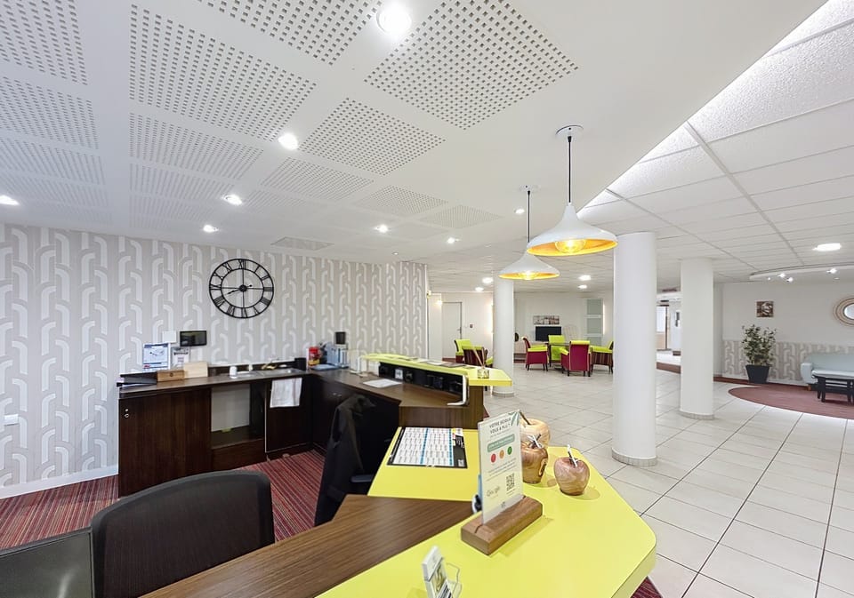 Front desk area with staff ready to assist guests during their stay.