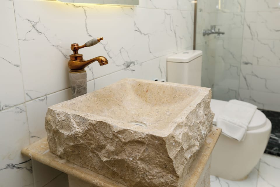 Shower, free toiletries, hair dryer, slippers