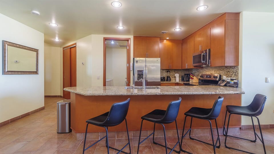 four bar stools at th kitchen counter