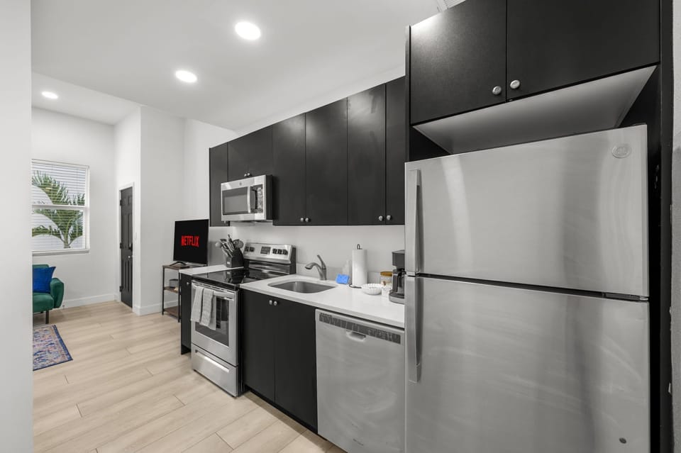 Whip up your culinary masterpieces (or just some popcorn!) in our sleek and fully equipped kitchen. Whether you're a gourmet chef or a microwave maestro, you'll find everything you need right here. Coffee's on us (almost)!