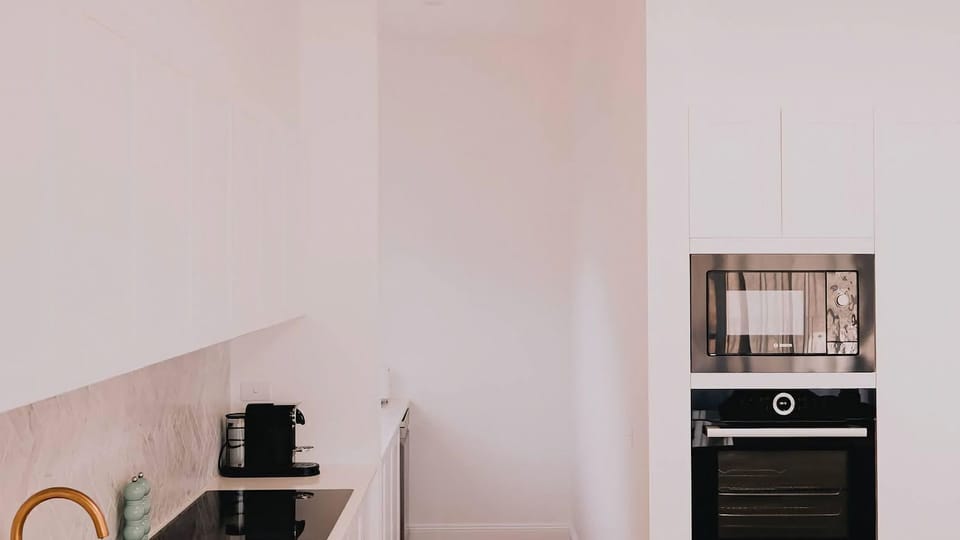 Looking through to the butlers pantry - you will find a secondary sink, dishwasher, the kettle & toaster and of course the coffee station.