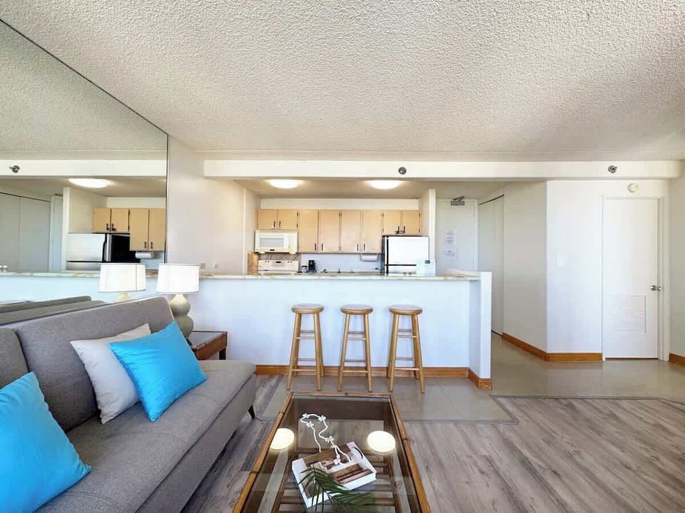 Relax in this inviting open-concept living area, where the kitchen seamlessly flows into the living room.