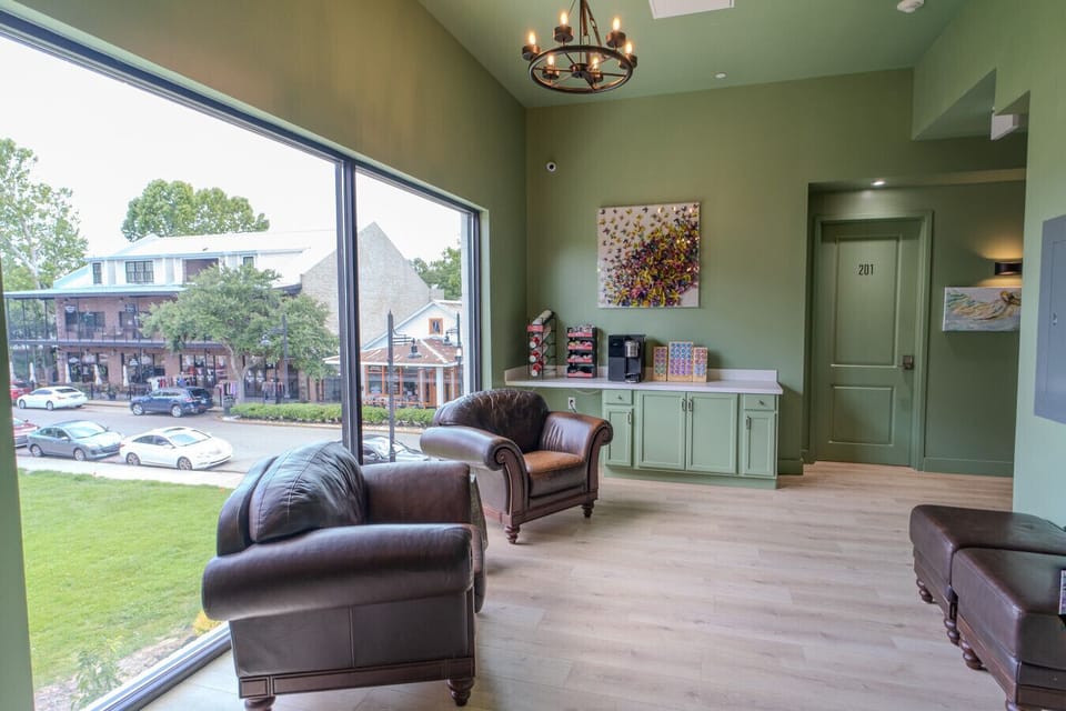 Guests have access to a shared coffee nook and sitting area overlooking Government Street