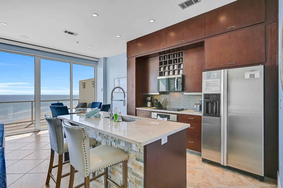 Bar, water dispenser, refrigerator, microwave, dining area, view