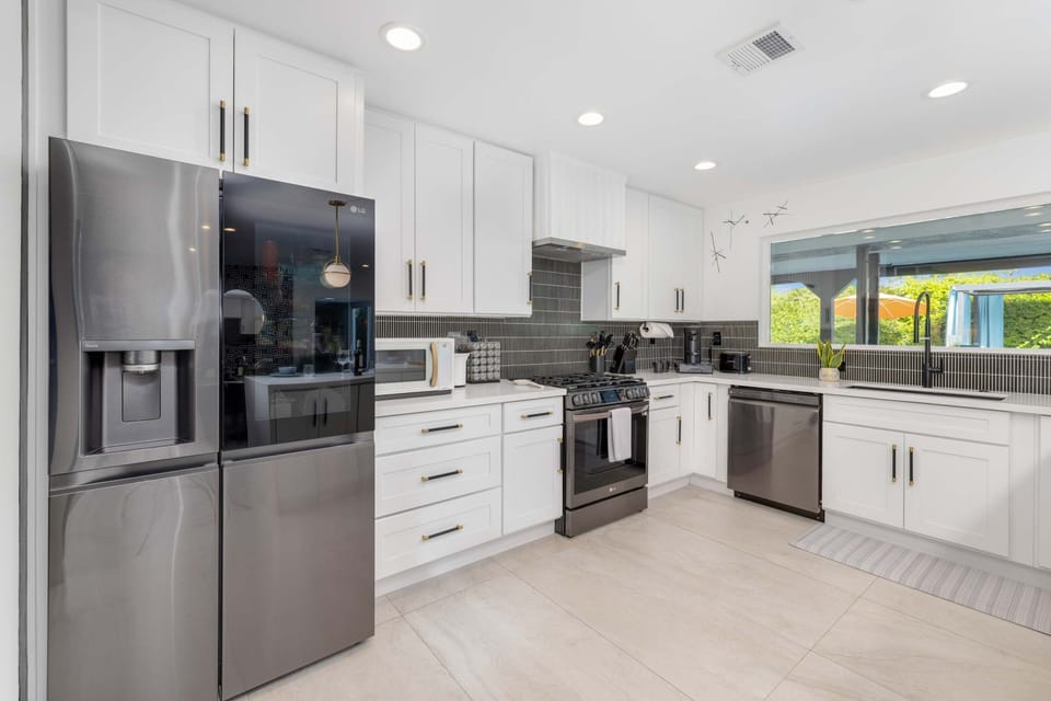 The open kitchen offers ample space & all the comforts of home​