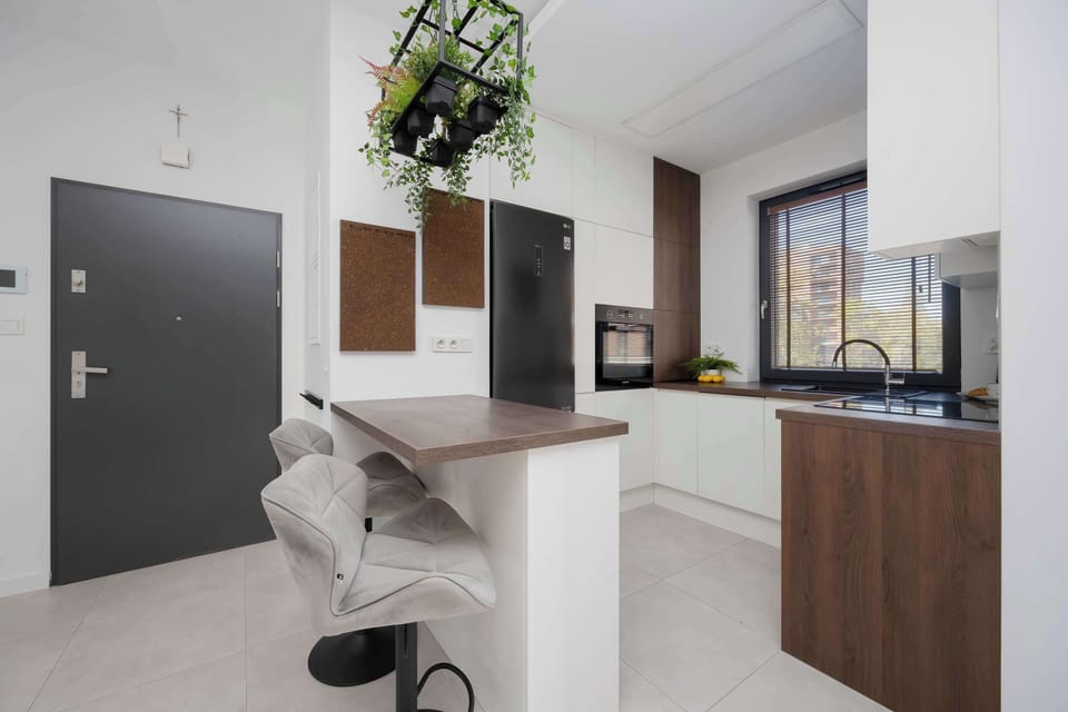 The functional kitchen island with bar stools combines cooking comfort with the joy of socializing while preparing meals.