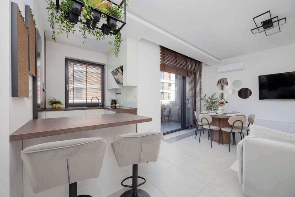 The bar stool by the kitchen island is perfect for a quick coffee or chatting while cooking together.
