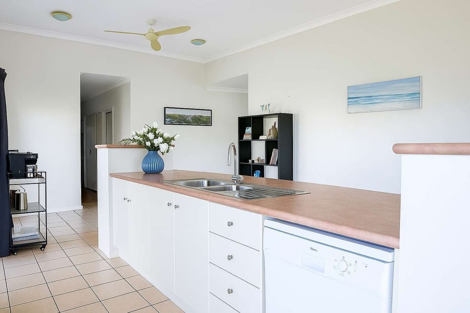 Open-Plan Kitchen and Dining Area with Balcony Access