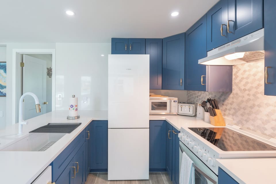 Kitchen has modern Beachy vibes.