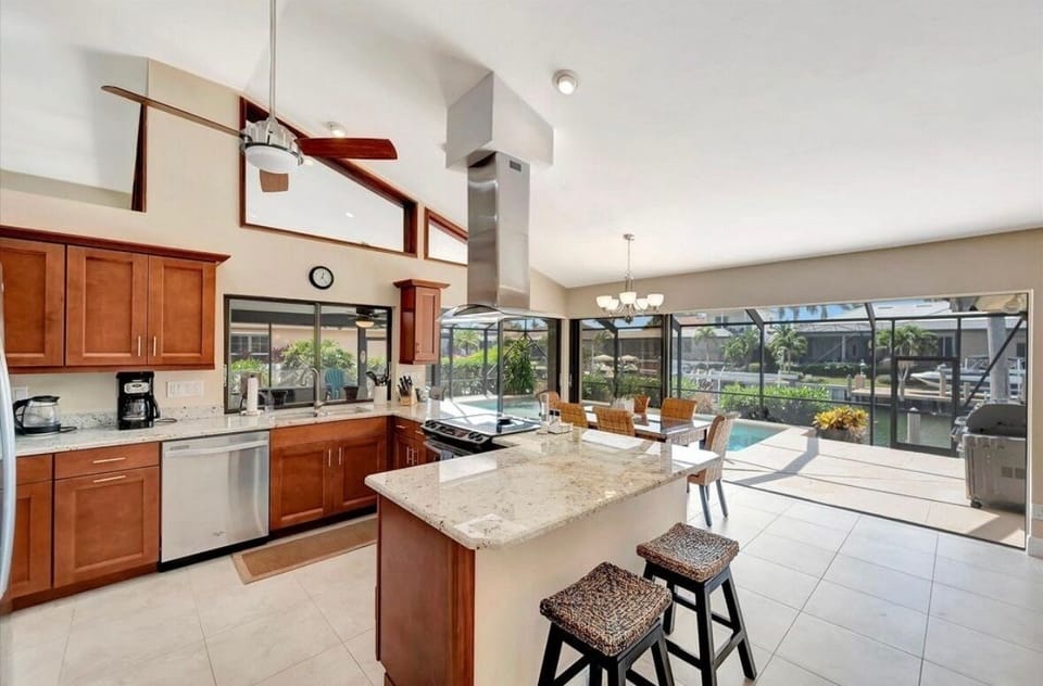 Chefs kitchen with seamless patio doors that open fully.