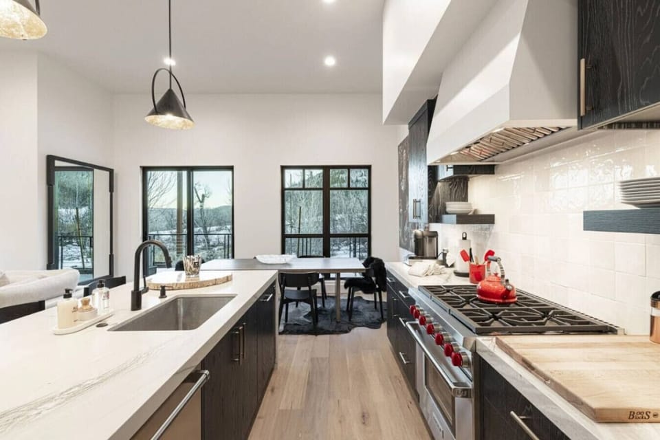Craft gourmet meals while panoramic views unfold beyond the windows.