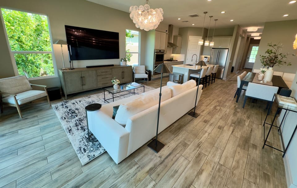 Open floor plan between kitchen, dining, and great room