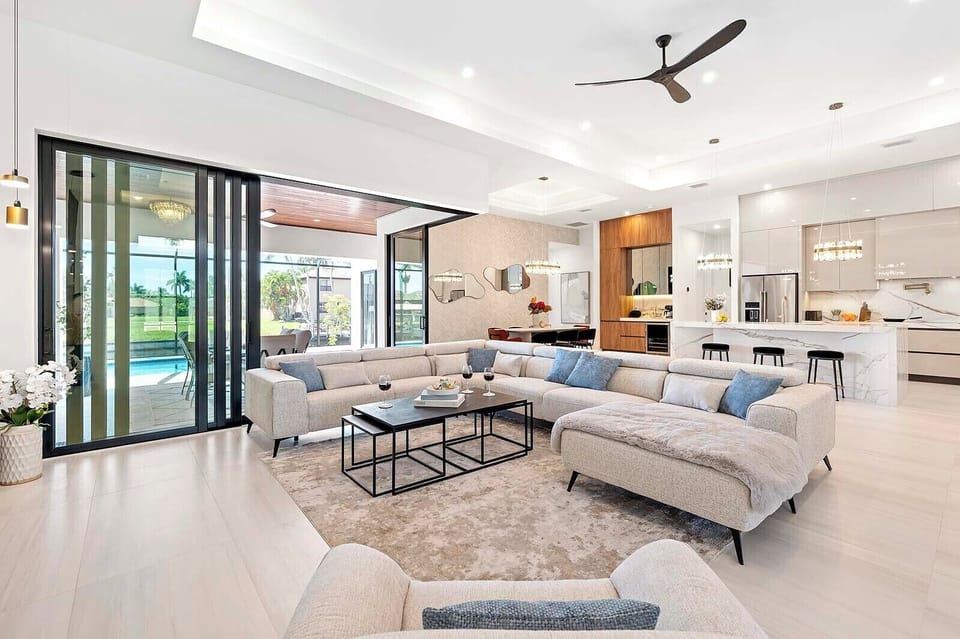 Modern Living Room with Open Floor Plan and Views of the Lanai and Pool Area