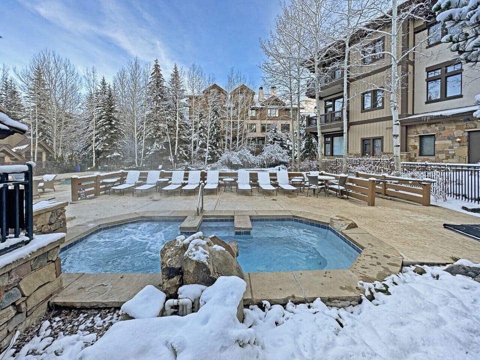 Soak your exhausted body in the steamy hot tub beside a warm pool, snow-dusted pines framing the scene. After a thrilling Beaver Creek ski day, unwind in blissful heat, feeling relaxation melt away tension. A cozy, inviting escape awaits at Arrowhead Vill
