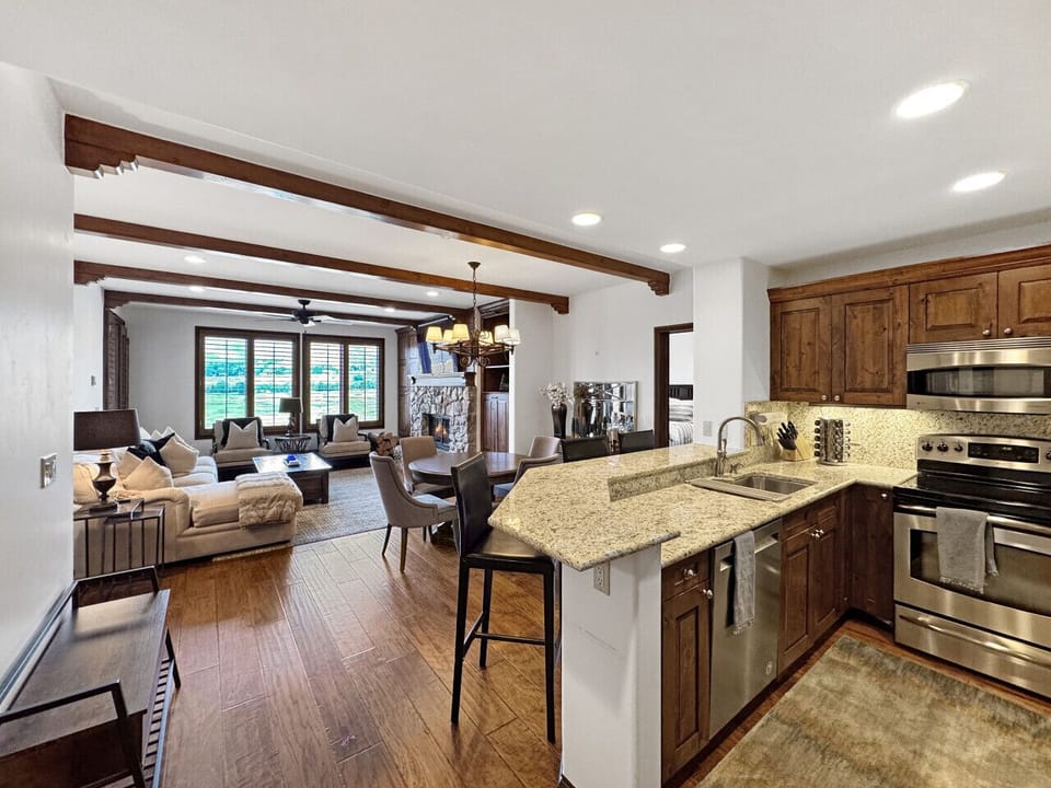 High-end stainless steel appliances, dishwasher, sink, oven, stovetop, coffee maker, refrigerator, freezer, offer home-like luxury for your ski vacation, unlike standard hotel rooms