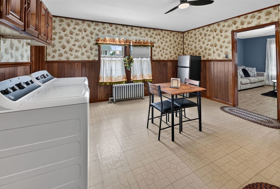 interior, indoor, climate control, couch, refrigerator, living area, stovetop, 