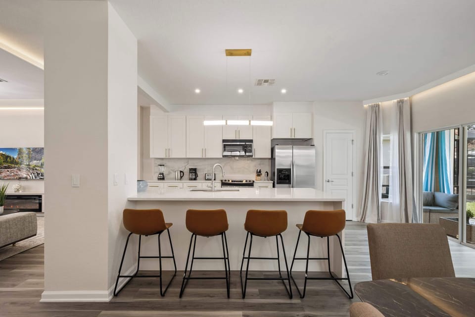 Bright, open kitchen with a four-seat breakfast bar.