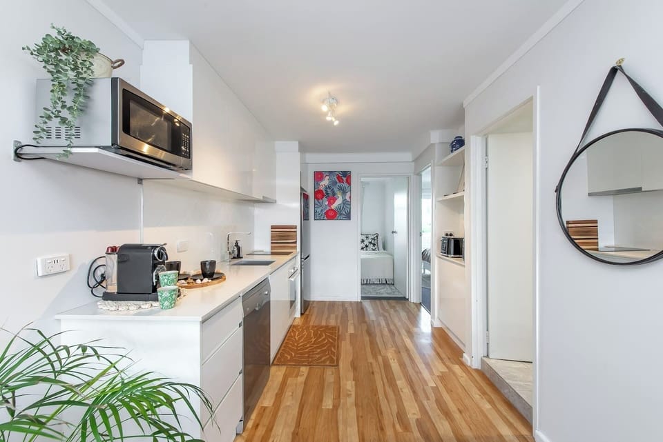 Very very well approinted kitchen with microwave stove over full fridge dishwasher & express machine