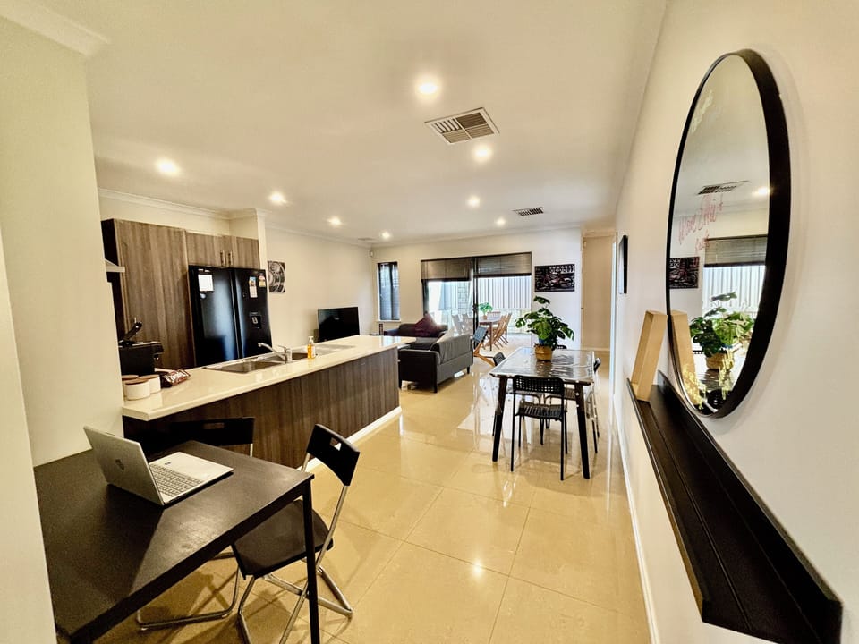 Lovely open concept set up and a table for your laptop or move it to use to hold food for family meal as you dine