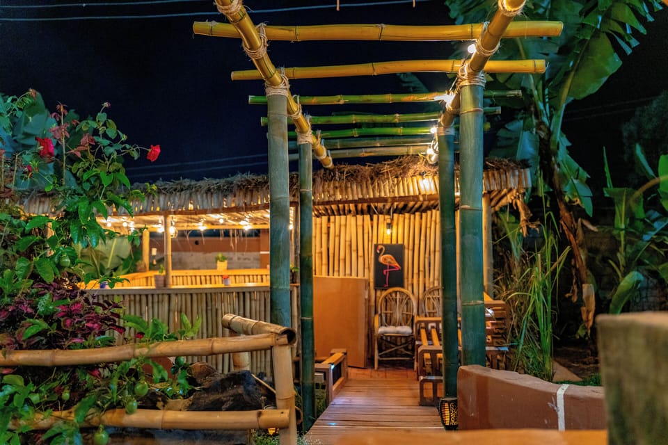 Bamboo pergola.  Hot tub gazebo at the end