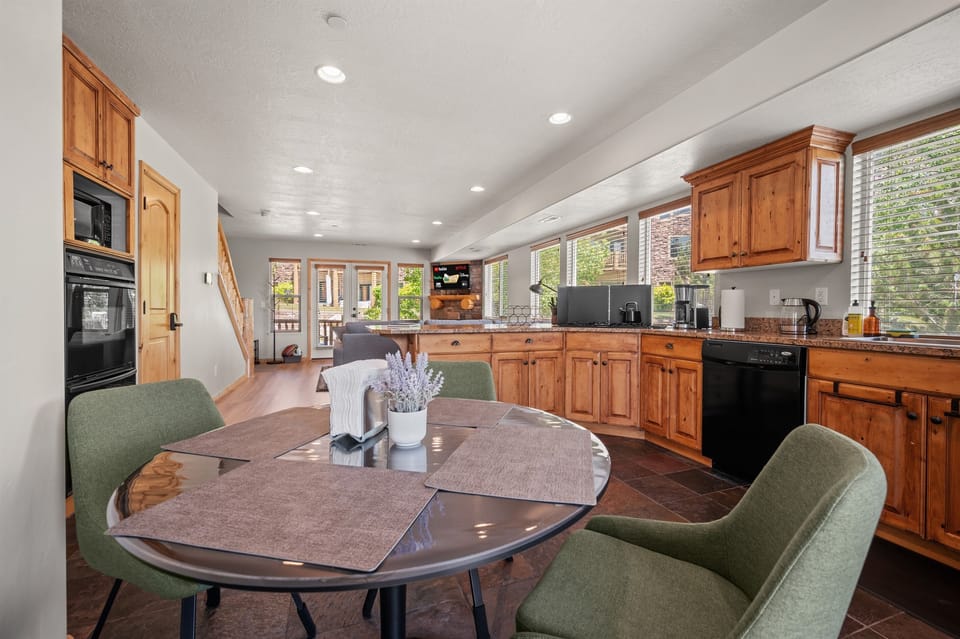The open-concept living space, complete with a dining area, facilitates effortless conversation with family and friends.