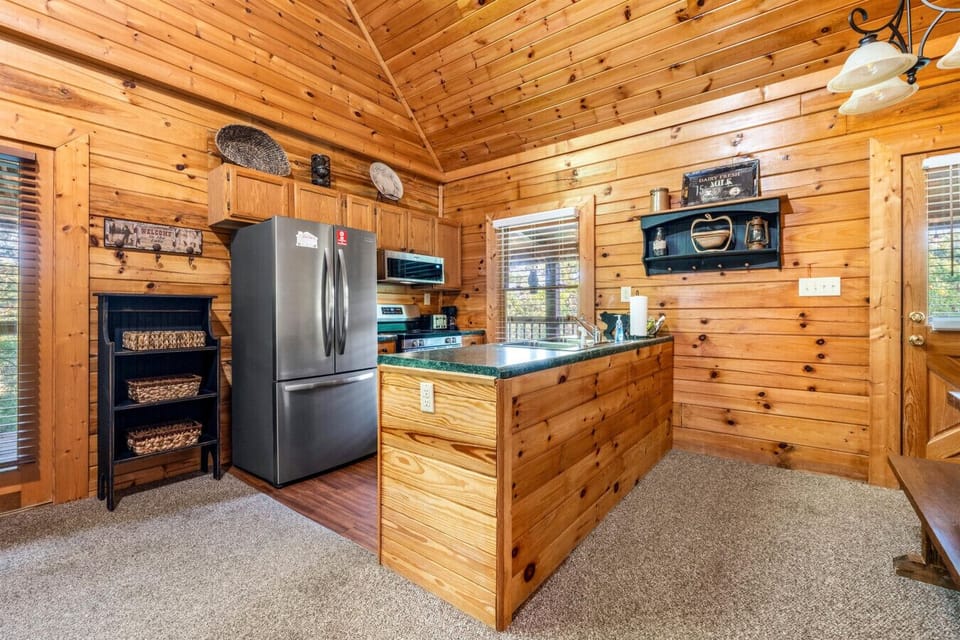 The kitchen blends modern appliances with rustic charm, keeping everything within reach.