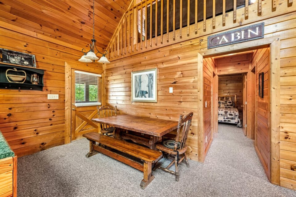 Gather around the rustic table where delicious meals and board games create lasting memories.