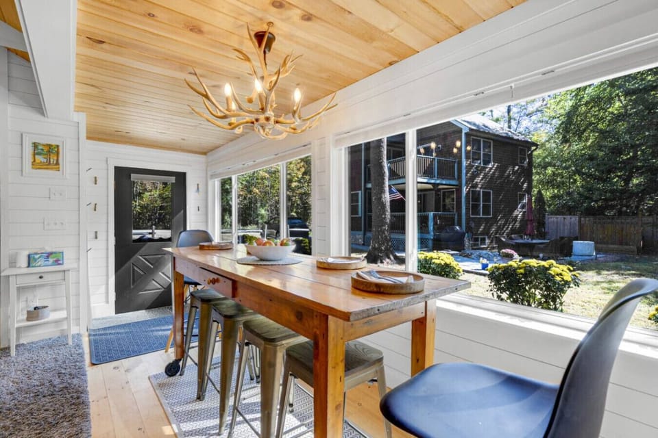 Enjoy meals together in this beautiful dining area with large windows.