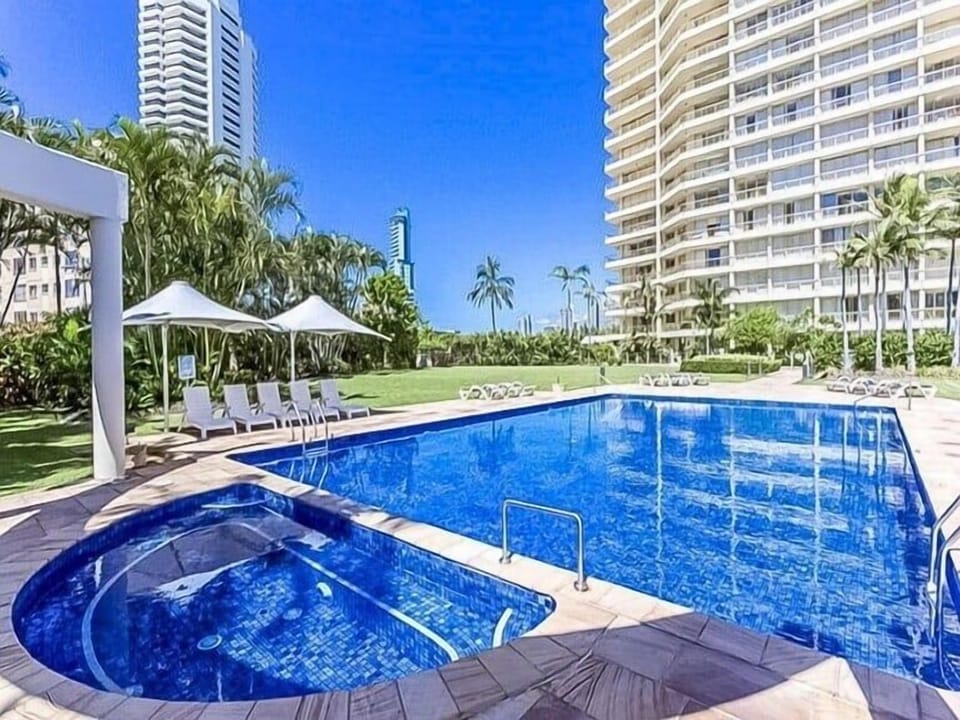Outdoor pool and spa add resort-style space between the sand and dining outings.